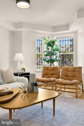 a living room with furniture and a lamp