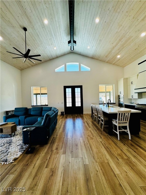 8946 Highway 93 Caliente, NV 89008 - Photo 14 of 40 Living area with a wooden ceiling with exposed beams, light wood-type flooring, recessed lighting, high vaulted ceiling, and ceiling fan
