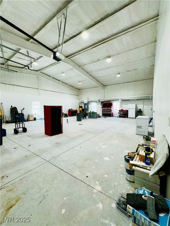 8946 Highway 93 Caliente, NV 89008 - Photo 15 of 40 Garage featuring freestanding refrigerator and a garage door opener