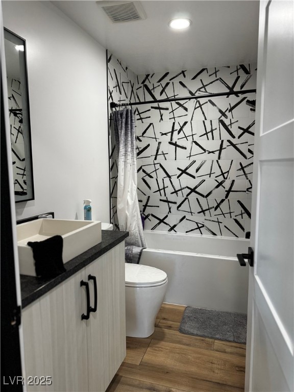 8946 Highway 93 Caliente, NV 89008 - Photo 16 of 40 Full bathroom with shower / bath combo with shower curtain, vanity, dark wood-style floors, and recessed lighting