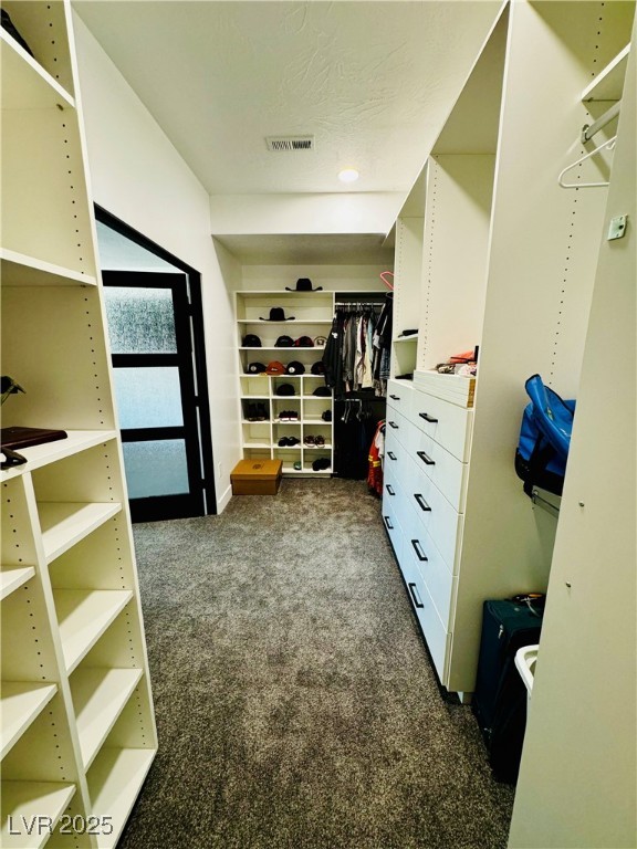 8946 Highway 93 Caliente, NV 89008 - Photo 22 of 40 Master walk in closet with dark carpet