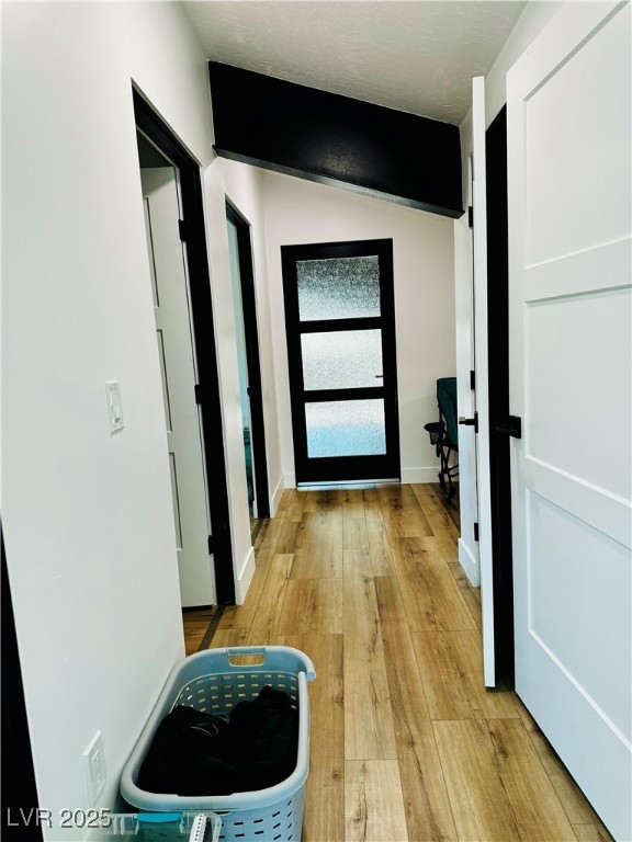 8946 Highway 93 Caliente, NV 89008 - Photo 28 of 40 Doorway to outside featuring hardwood / wood-style floors and baseboards
