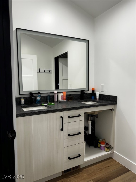 8946 Highway 93 Caliente, NV 89008 - Photo 32 of 40 Bathroom featuring wood finished floors and double vanity