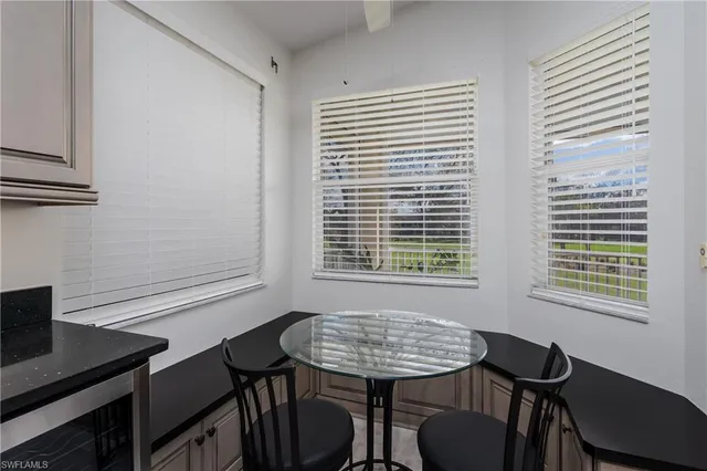 a view of a room that has a table and chair in it
