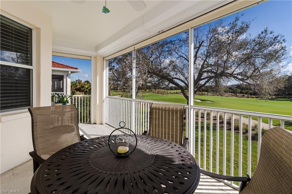640 Lalique Circle, Unit 405 Naples, FL 34119 - Photo 2 of 49 a view of a balcony with chairs