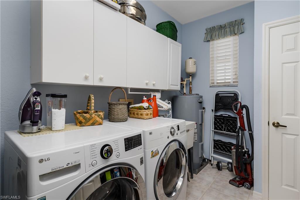 640 Lalique Circle, Unit 405 Naples, FL 34119 - Photo 29 of 49 a utility room with dryer and washer