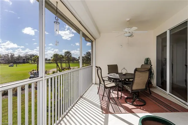 a view of a balcony with furniture and garden