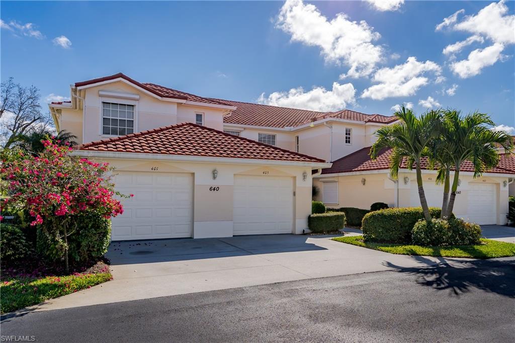 640 Lalique Circle, Unit 405 Naples, FL 34119 - Photo 33 of 49 a house view with a garden space