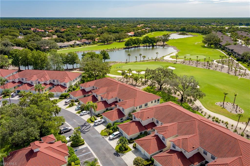 640 Lalique Circle, Unit 405 Naples, FL 34119 - Photo 39 of 49 an aerial view of residential houses with outdoor space