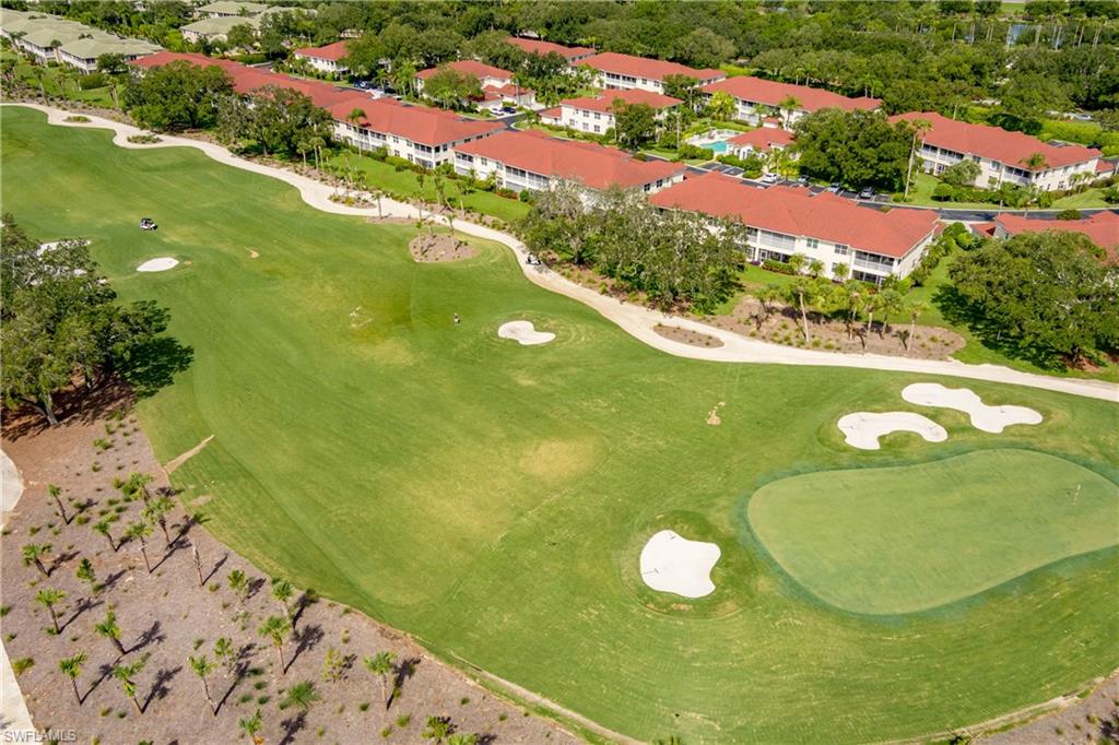 640 Lalique Circle, Unit 405 Naples, FL 34119 - Photo 43 of 49 a view of swimming pool from a balcony