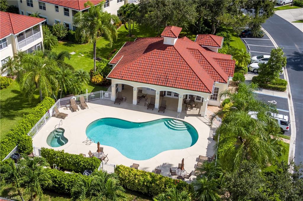 640 Lalique Circle, Unit 405 Naples, FL 34119 - Photo 47 of 49 an aerial view of a house with swimming pool and garden