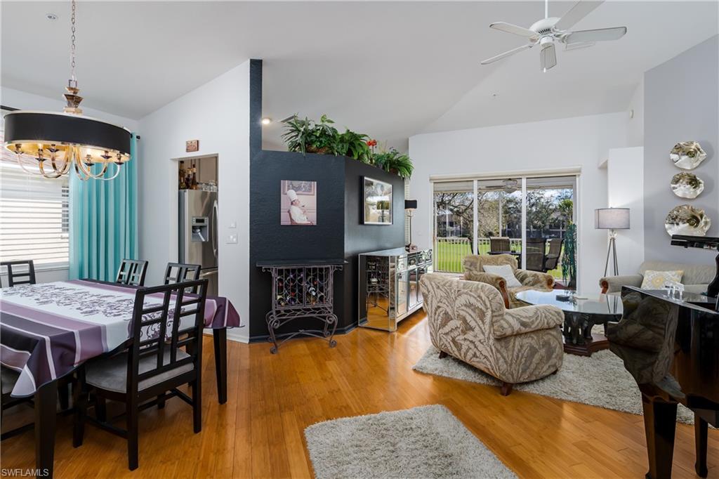 640 Lalique Circle, Unit 405 Naples, FL 34119 - Photo 5 of 49 a living room with furniture and a fireplace