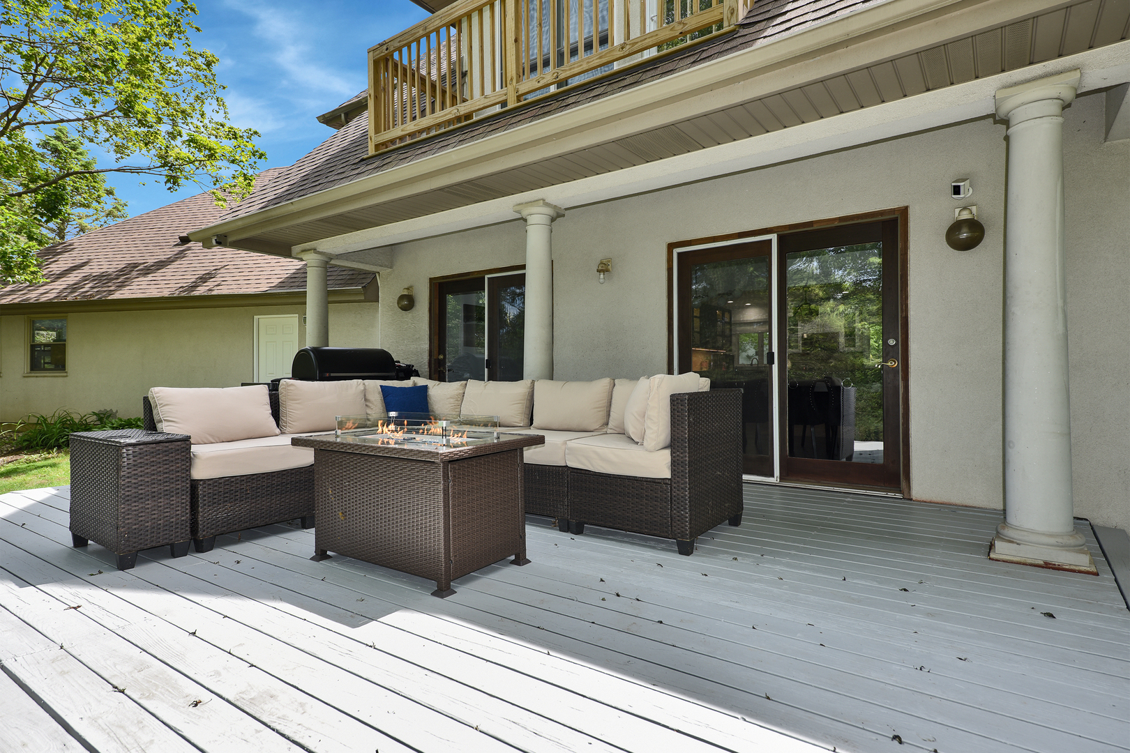 144 North Highland Road Inverness, IL 60067 - Photo 36 of 49 a view of a patio with couches table and chairs with wooden floor