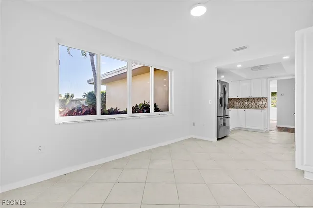 a view of kitchen with furniture and window
