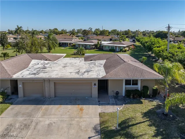 an aerial view of a house with a garden