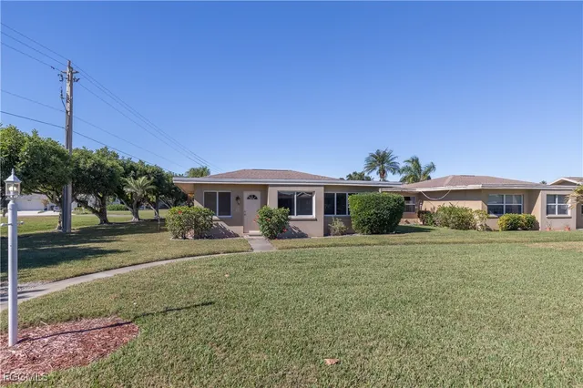 a view of a playground with basketball court