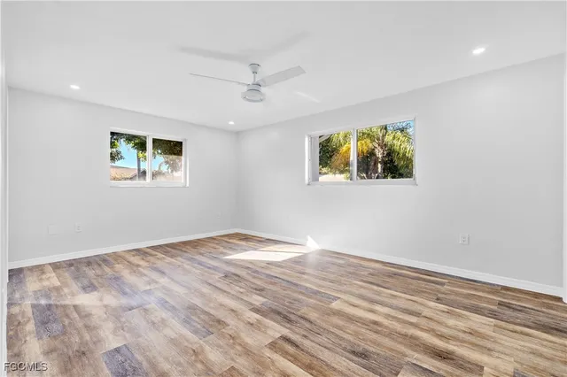 a view of room with window and ceiling fan