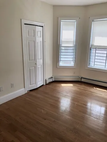 a view of a yard with a house in the background