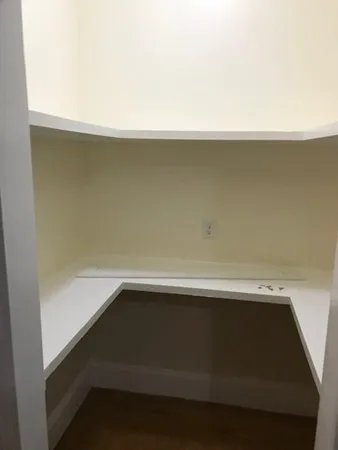 a bathroom with a granite countertop bathtub sink and mirror
