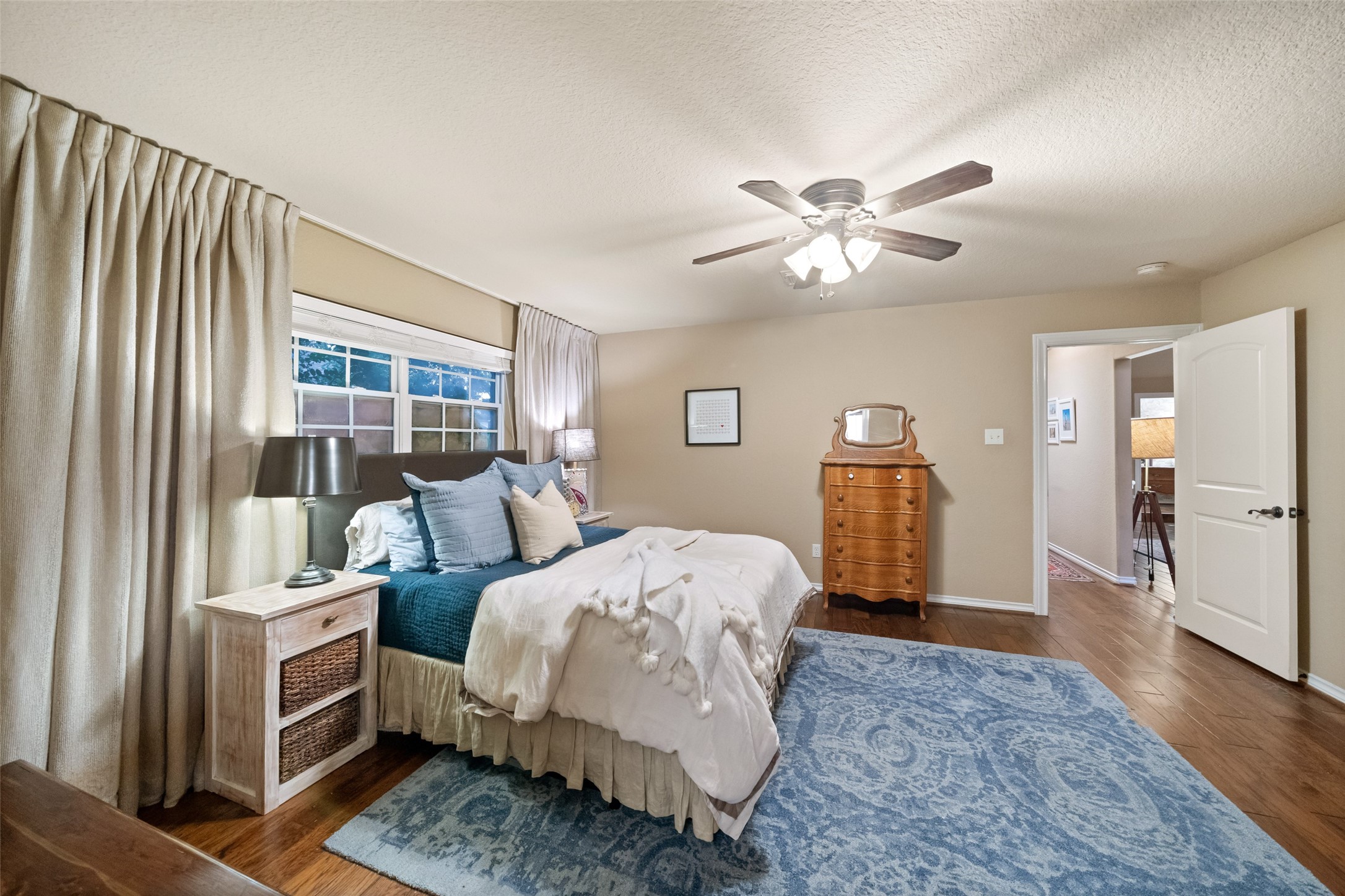 722 Shadow Brook Drive Spring, TX 77380 - Photo 21 of 27 a bedroom with a bed and wooden floor