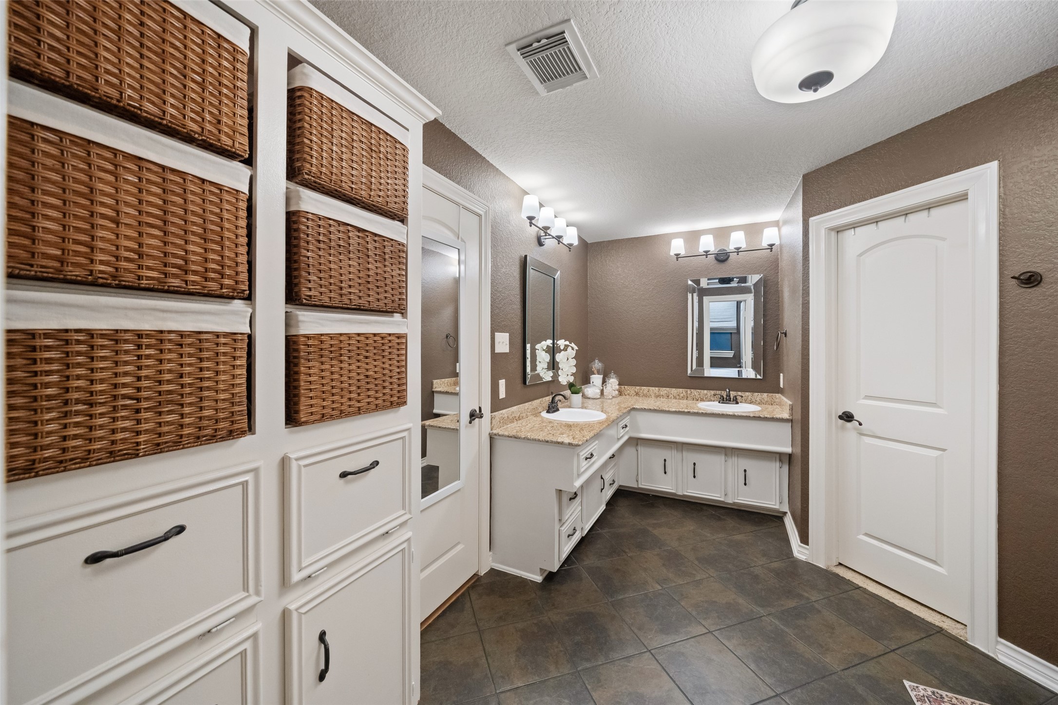 722 Shadow Brook Drive Spring, TX 77380 - Photo 22 of 27 a bathroom with a sink a large mirror and a shower
