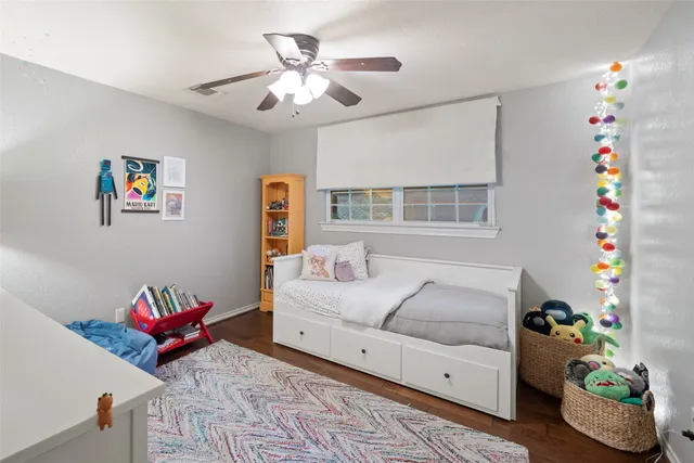 a living room with furniture and flowers