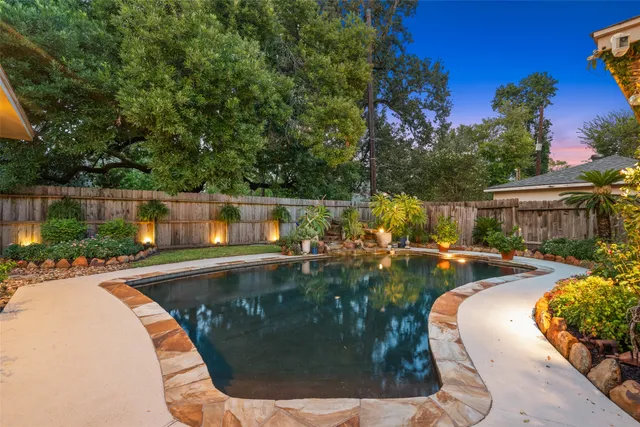 a view of a swimming pool with sitting area