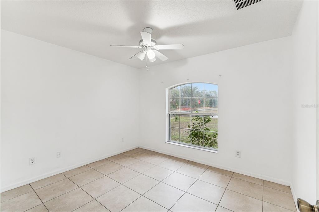 14 South Charles Avenue Inverness, FL 34453 - Photo 14 of 25 an empty room with windows