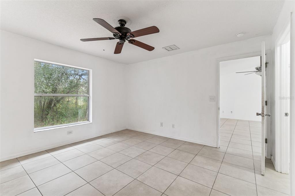 14 South Charles Avenue Inverness, FL 34453 - Photo 21 of 25 a view of an empty room with a window
