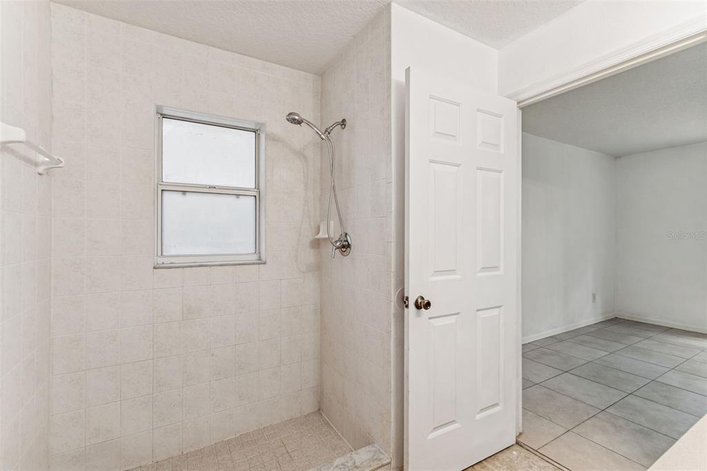 14 South Charles Avenue Inverness, FL 34453 - Photo 23 of 25 a bathroom with a granite countertop shower