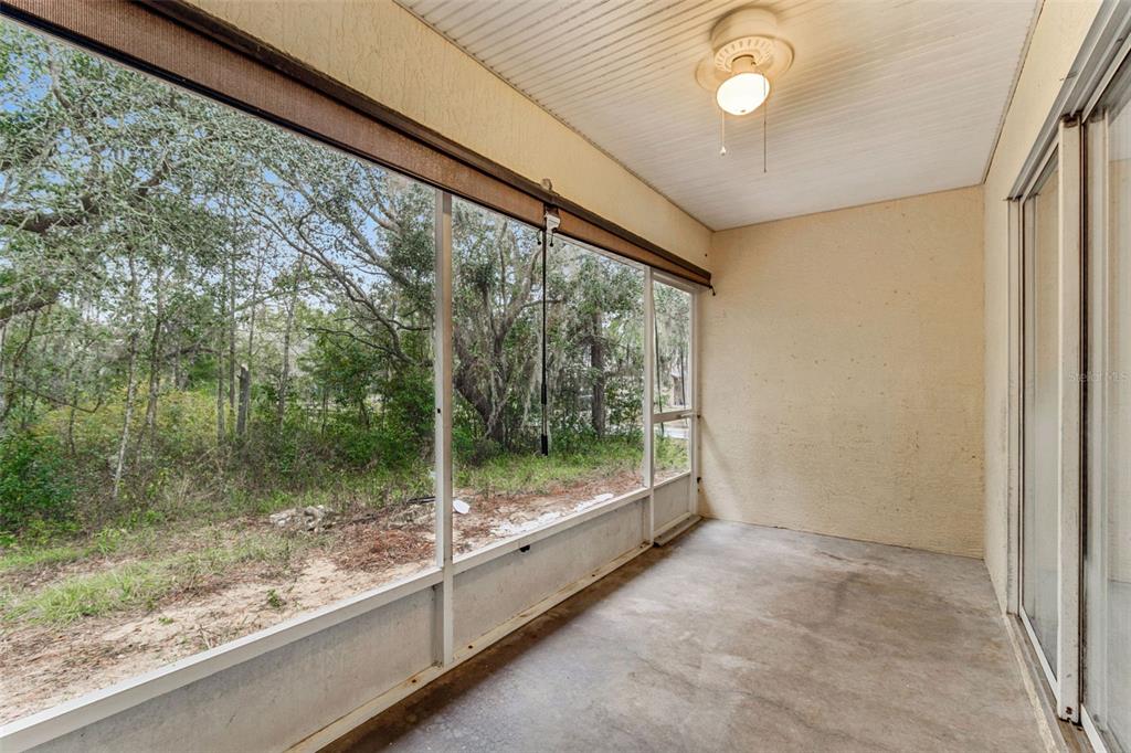 14 South Charles Avenue Inverness, FL 34453 - Photo 25 of 25 a view of a room with sliding glass door