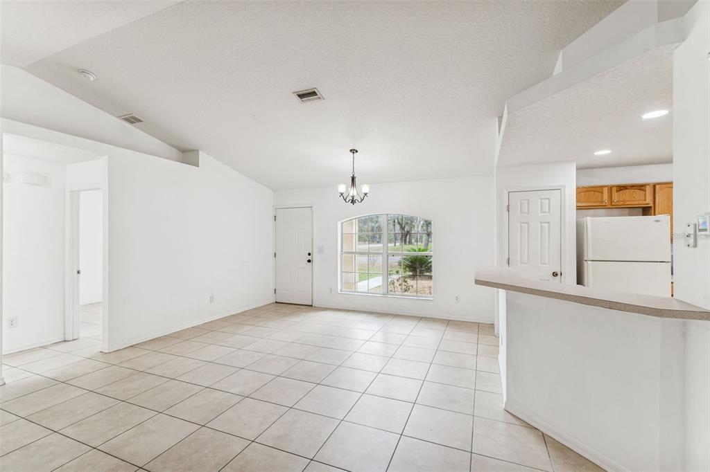 14 South Charles Avenue Inverness, FL 34453 - Photo 6 of 25 a view of an empty room with a window