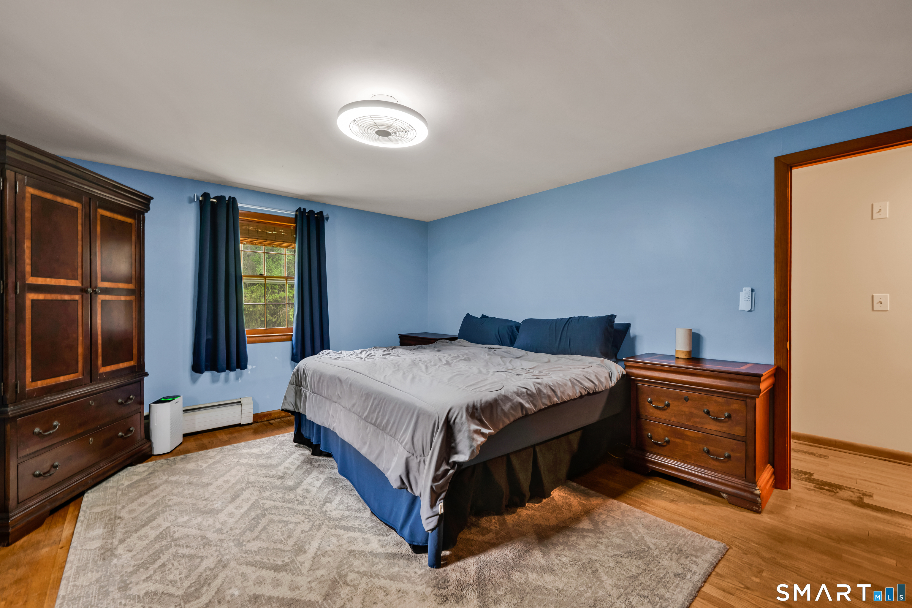 85 Timothy Road Naugatuck, CT 06770 - Photo 17 of 30 a bedroom with a bed and a flat tv screen on dresser