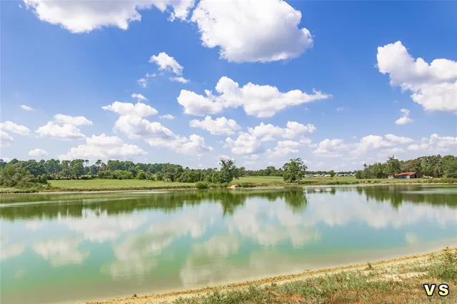 a view of a lake with a city