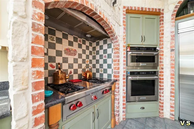 a kitchen with a stove and a microwave