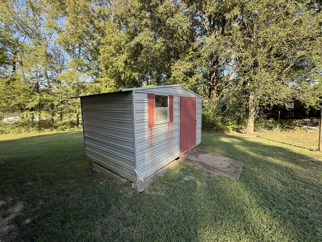 a backyard of a house with lots of green space