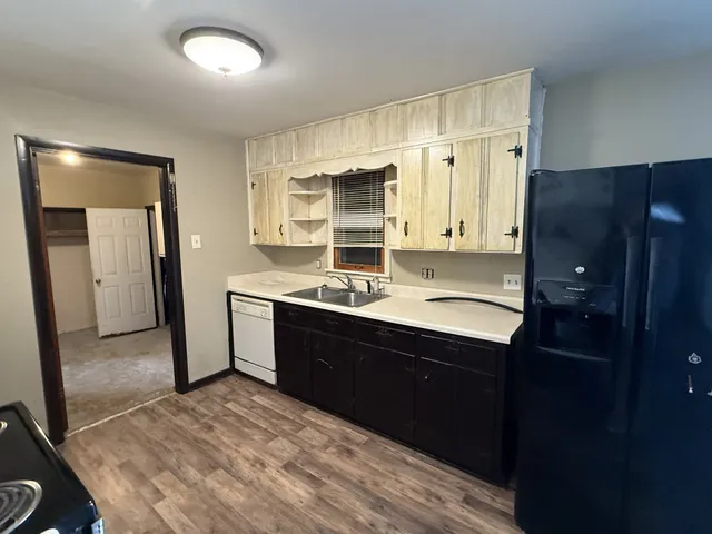 a spacious bathroom with a sink double vanity and a mirror