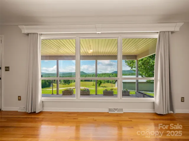 a view of a room that has a bed