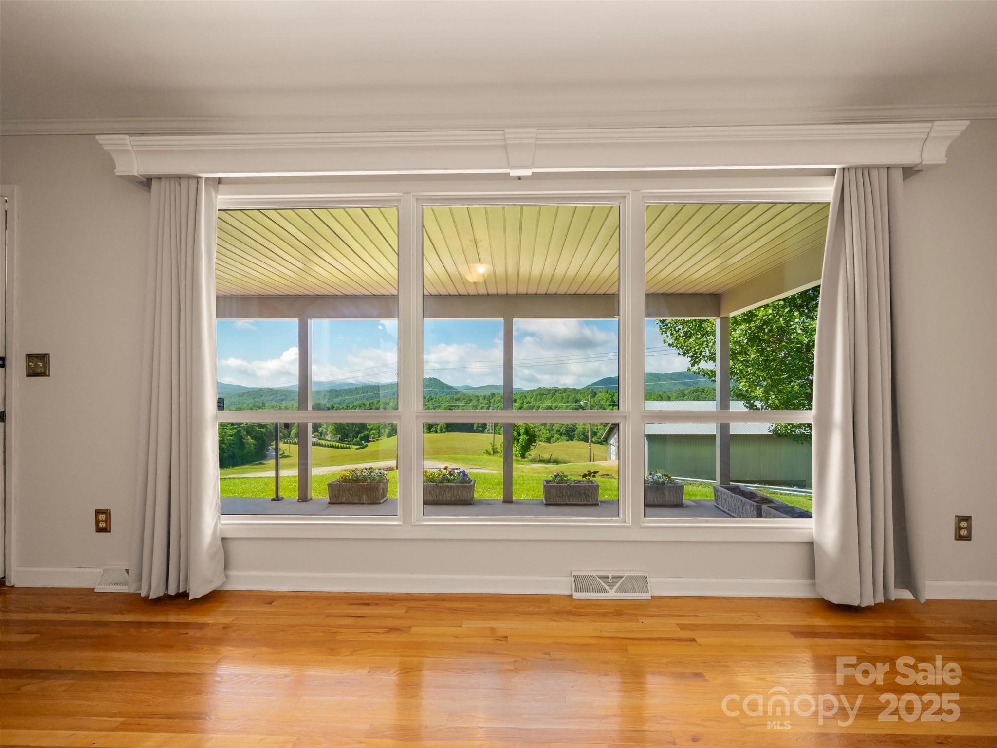 418 Mountain Page Road Saluda, NC 28773 - Photo 12 of 48 a view of a room that has a bed