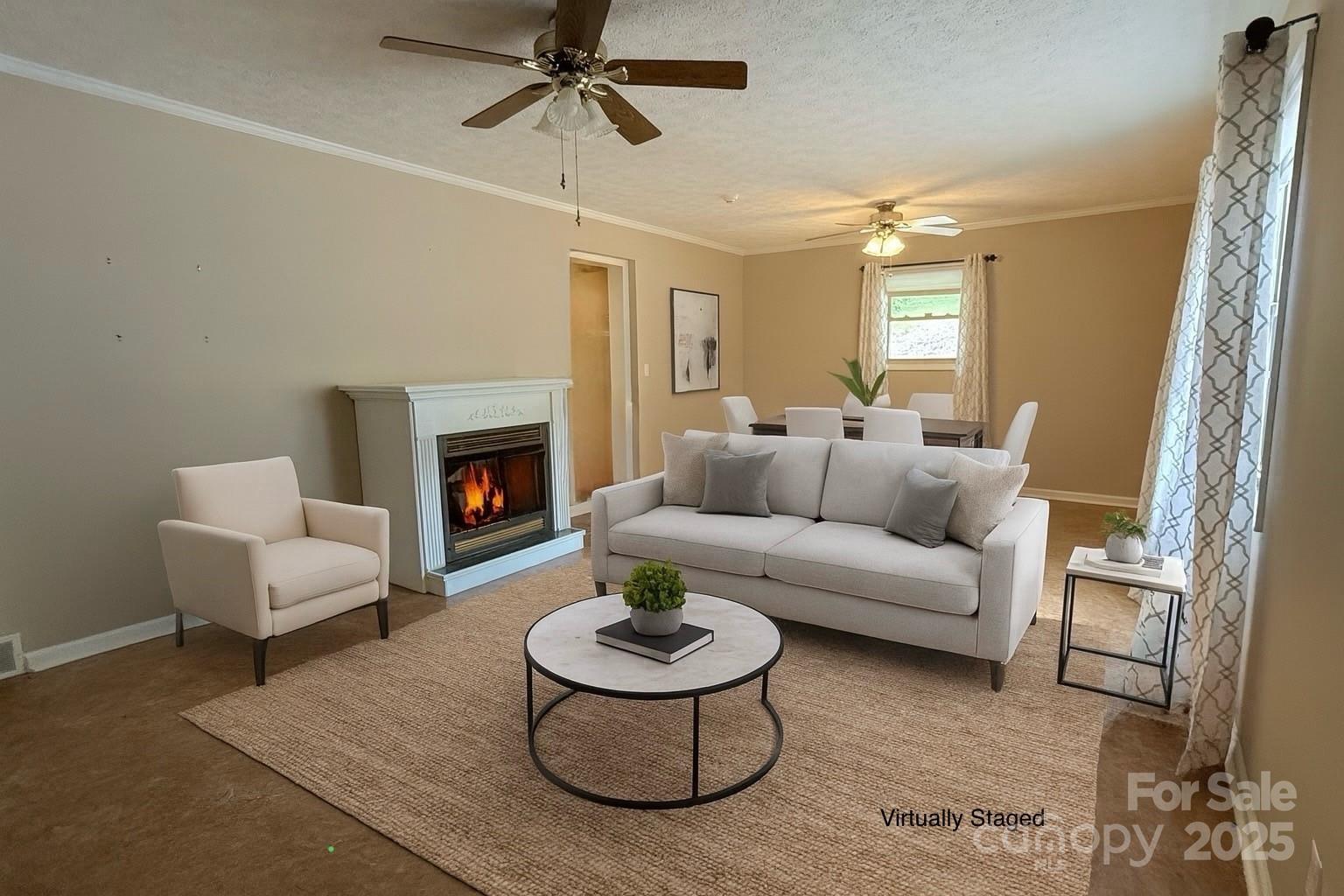 418 Mountain Page Road Saluda, NC 28773 - Photo 21 of 48 a living room with furniture and a fireplace