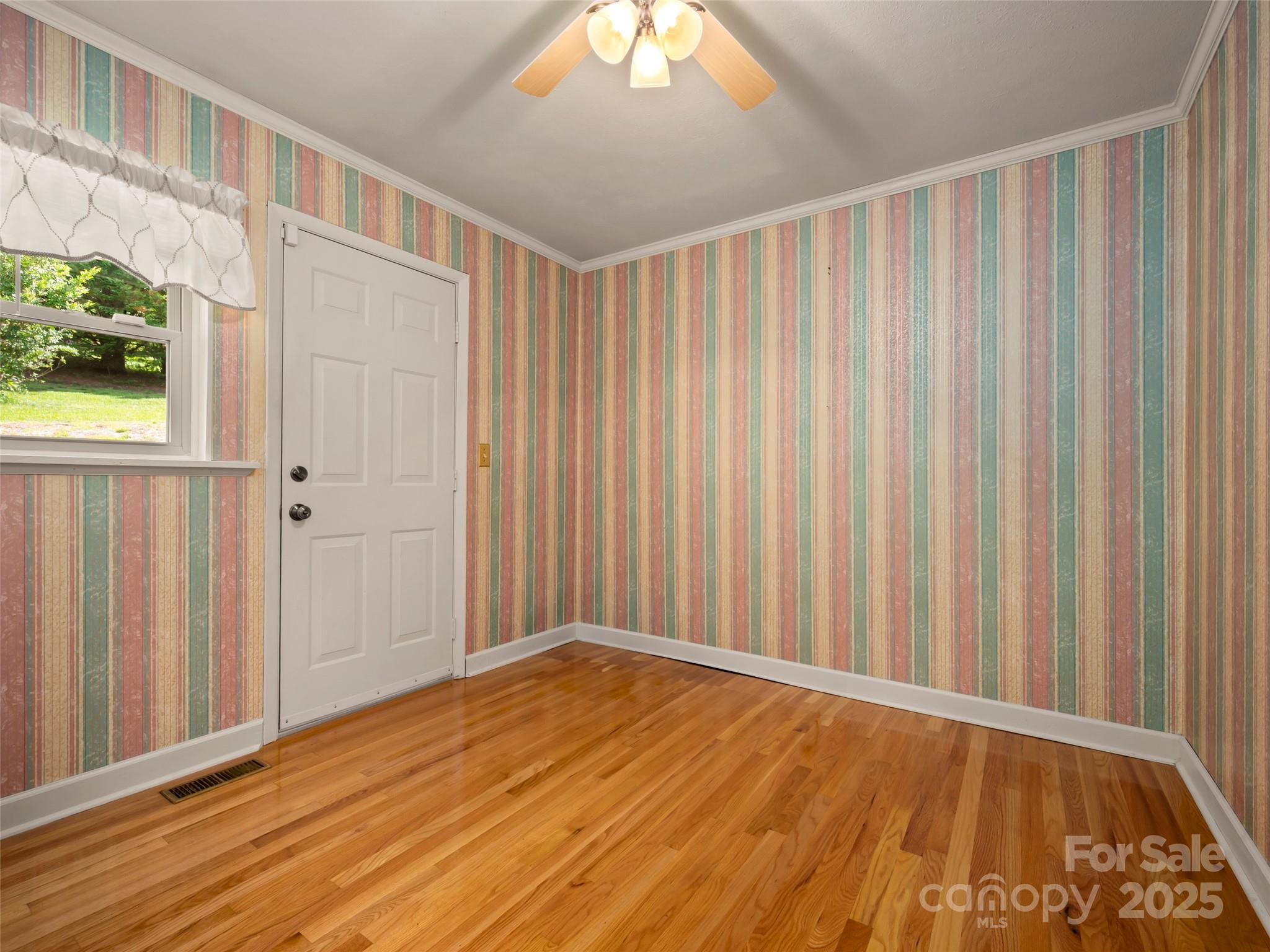 418 Mountain Page Road Saluda, NC 28773 - Photo 25 of 48 a view of a room with wooden floor and a window