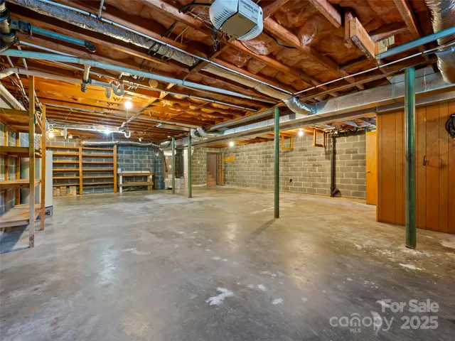a view of empty room with wooden ceiling