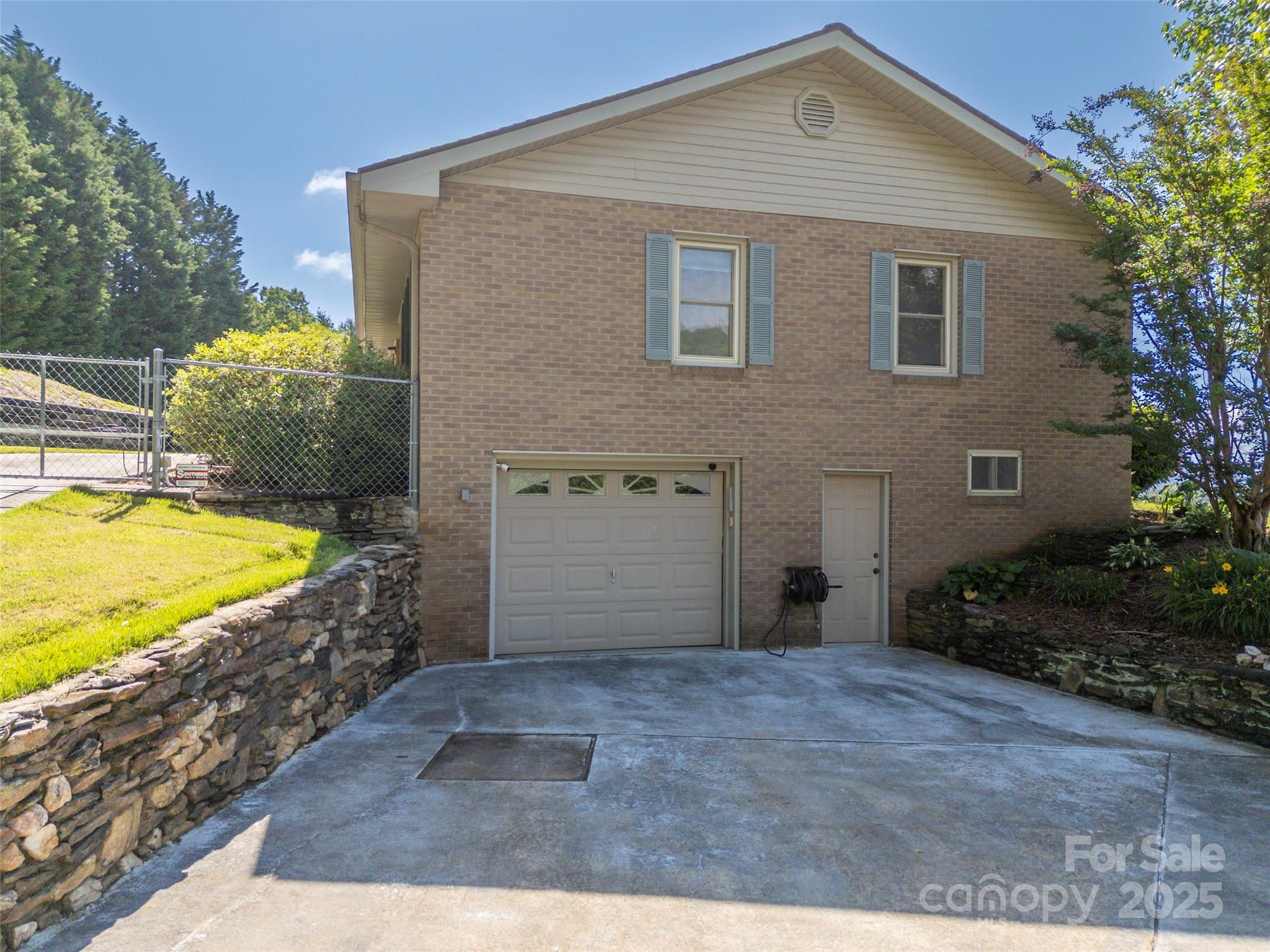 418 Mountain Page Road Saluda, NC 28773 - Photo 38 of 48 a front view of a house with a yard