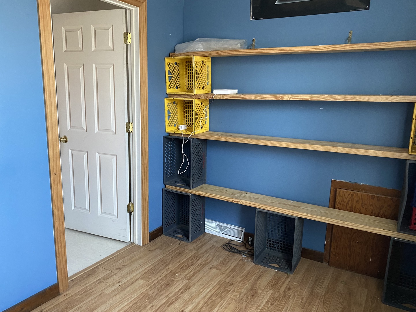 1663 East 7th Road Lostant, IL 61334 - Photo 13 of 16 a room with a closet and wooden floor