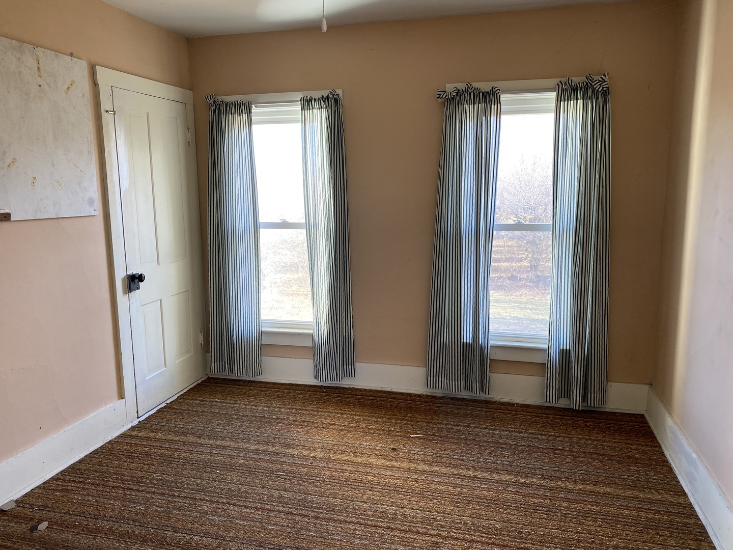 1663 East 7th Road Lostant, IL 61334 - Photo 9 of 16 an empty room with wooden floor and a window