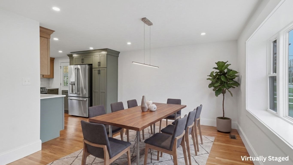 105 Stafford Road Lowell, MA 01852 - Photo 10 of 42 a dining room with furniture and a kitchen