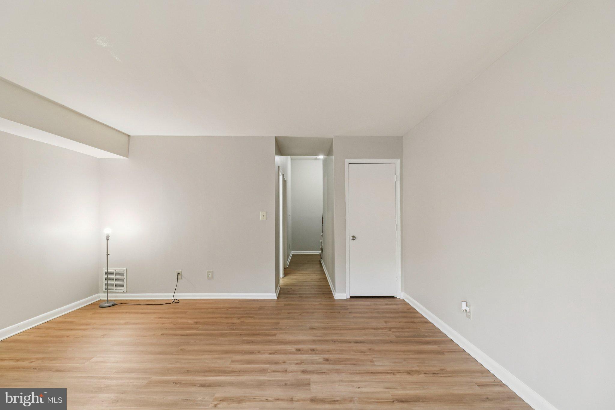 5912 Minutemen Road, Unit 295 Springfield, VA 22152 - Photo 26 of 55 a view of an empty room with wooden floor