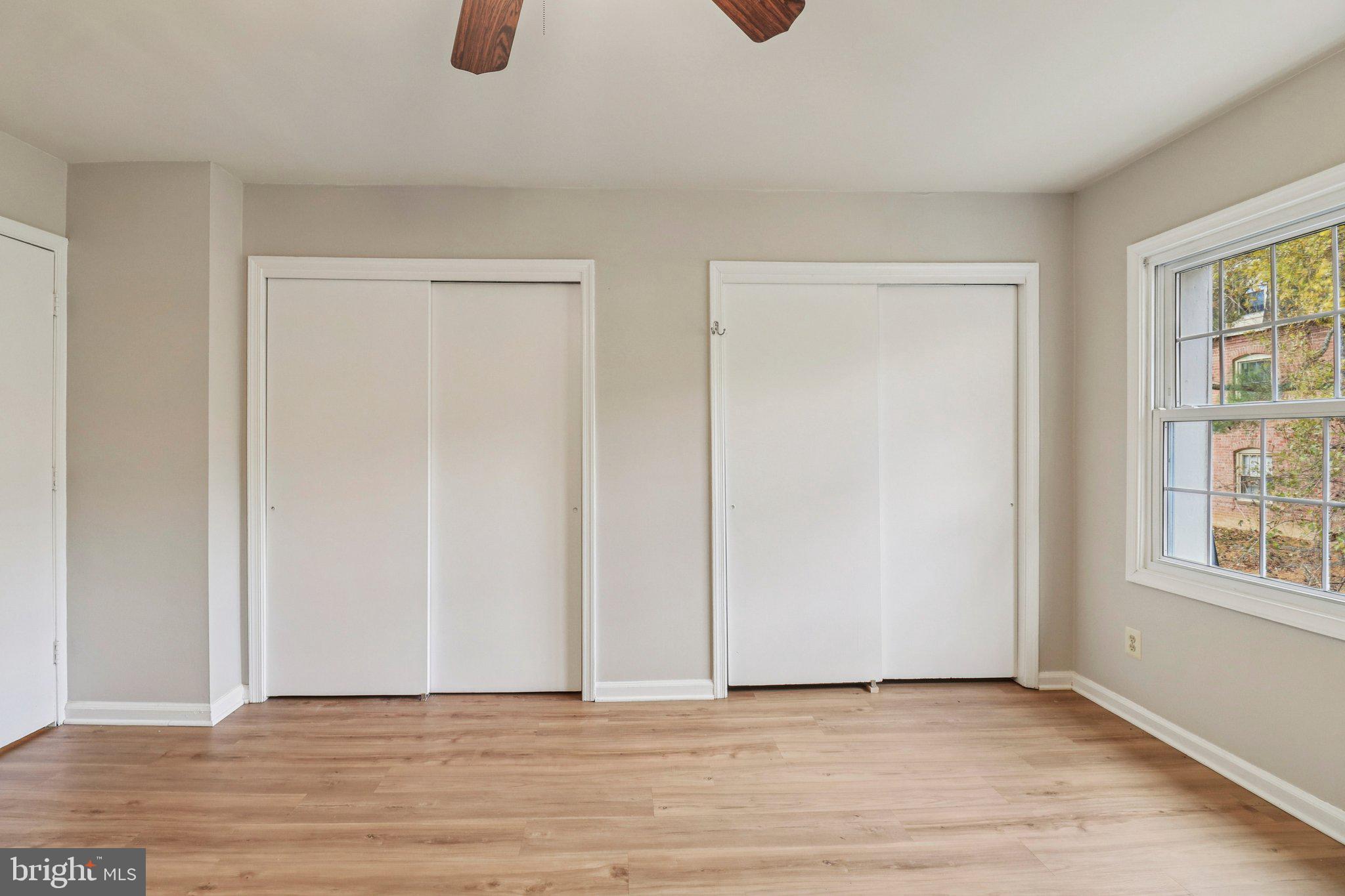 5912 Minutemen Road, Unit 295 Springfield, VA 22152 - Photo 30 of 55 an empty room with windows and closet