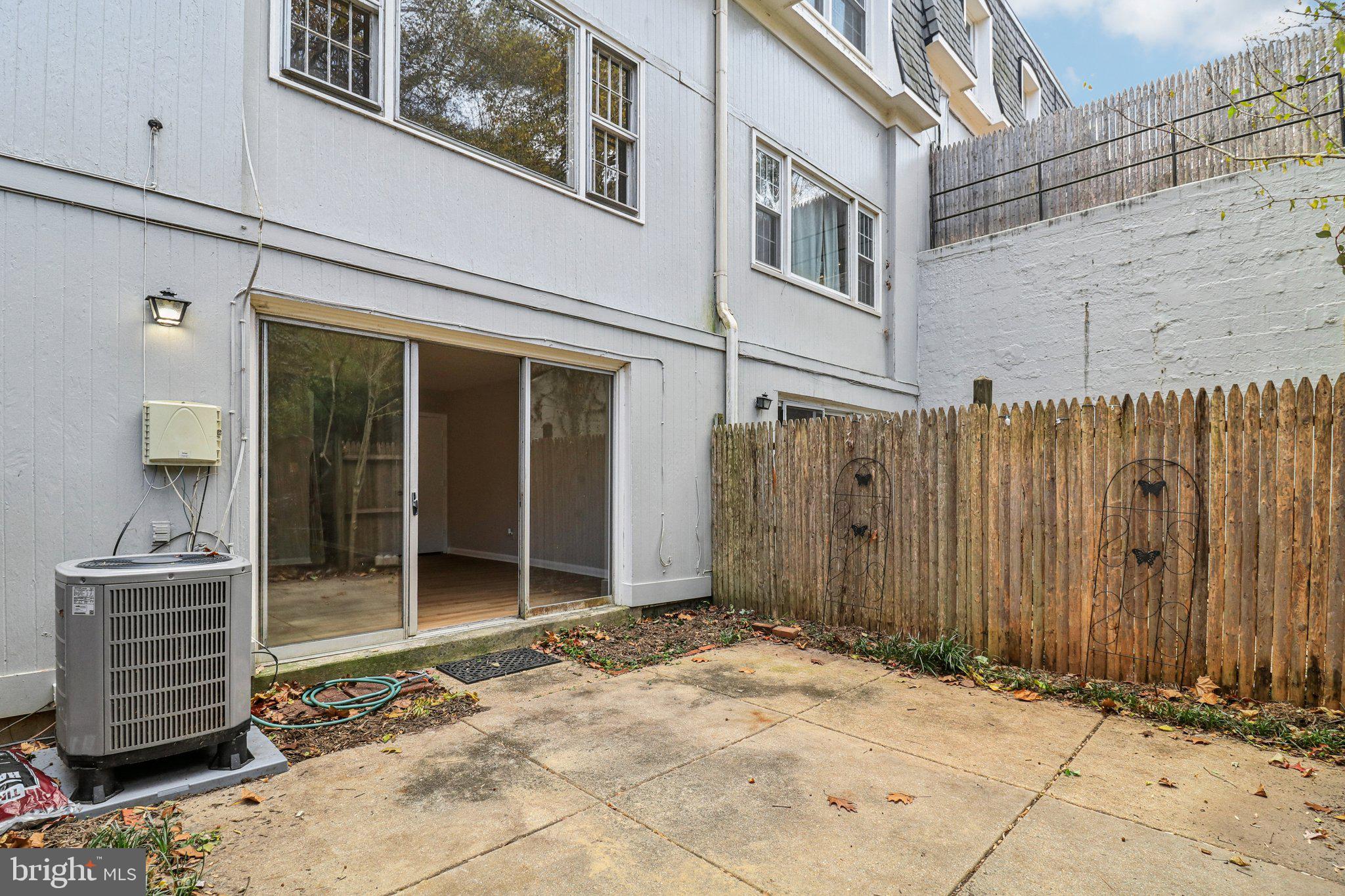 5912 Minutemen Road, Unit 295 Springfield, VA 22152 - Photo 40 of 55 a view of a house with a wooden door