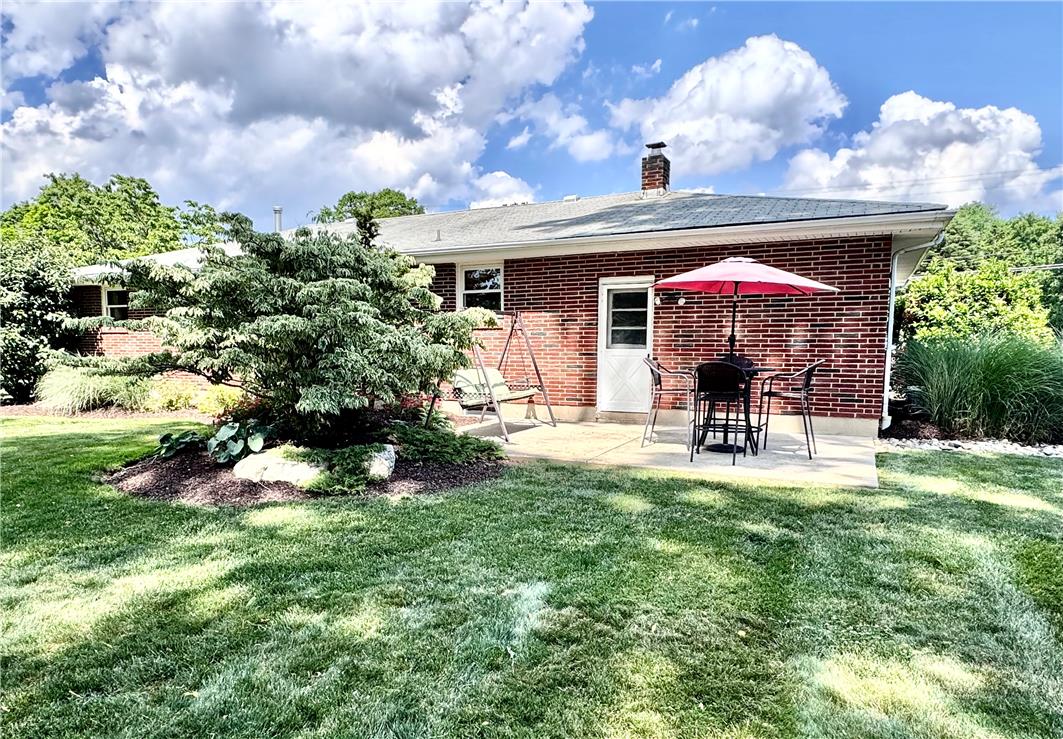 5334 Egypt Road Laurys Station, PA 18059 - Photo 48 of 55 A private backyard oasis with mature landscaping and a cozy brick patio.